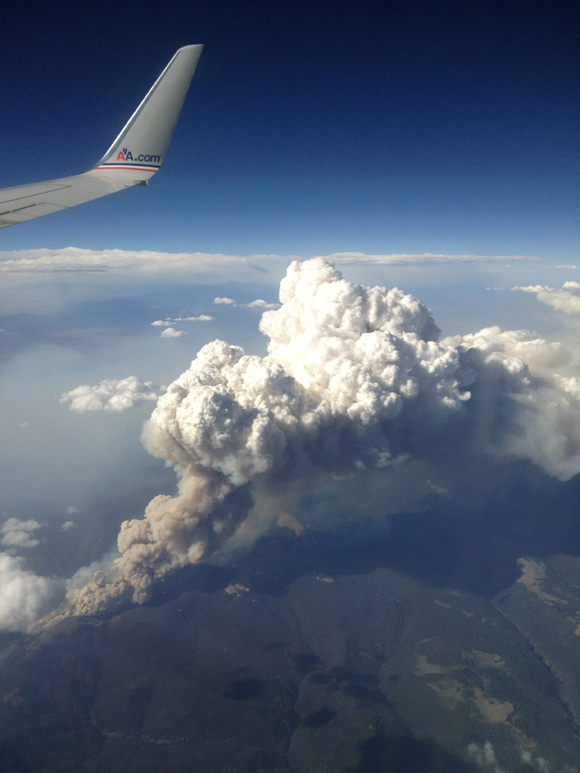 CNN iReporter Randy Kirton shot an image of smoke billowing from the fires in Colorado — all the way to his window on his flight to San Fransisco. (13673)